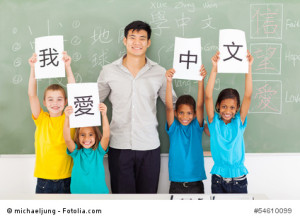 male chinese teacher with group multiracial students